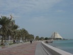 The road along the bay is called the Corniche. The building on the right is the Sheraton hotel.